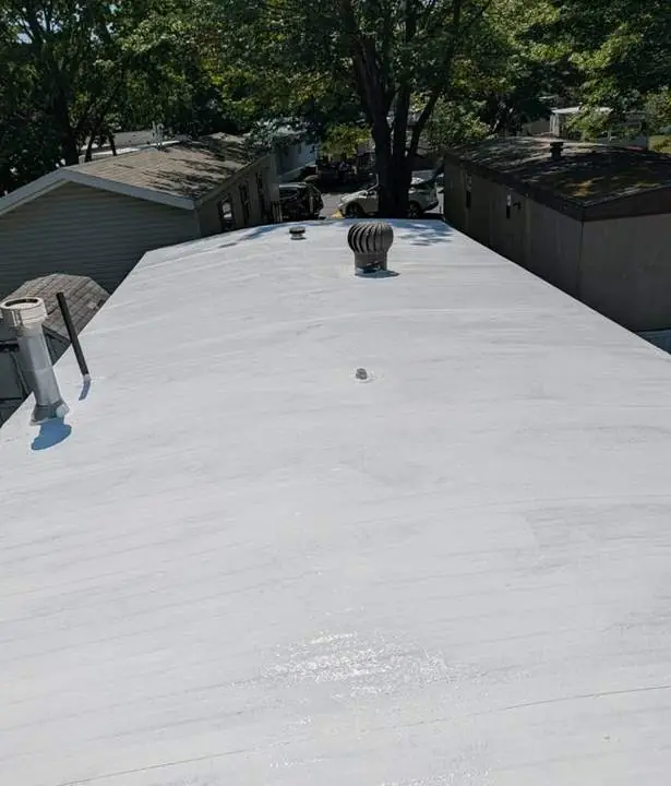 Completed manufactured home roof with white reflective coating