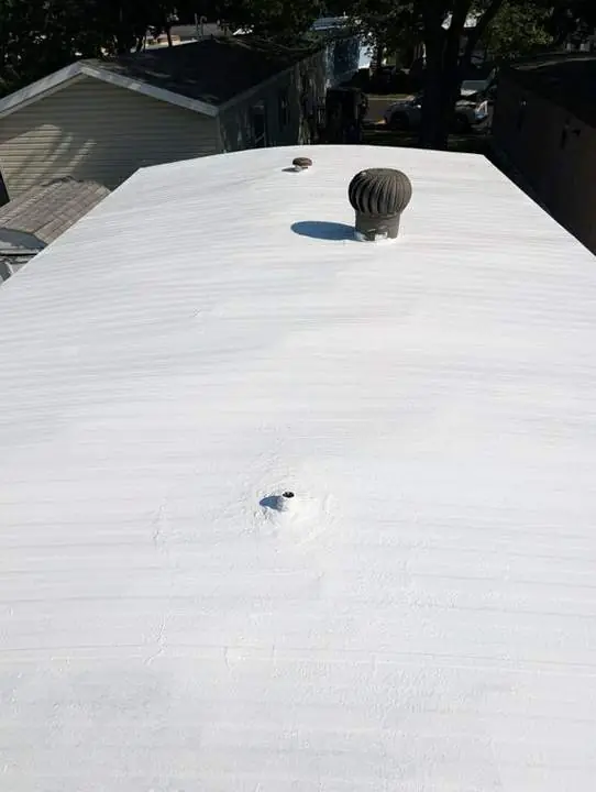 Finished coated manufactured home roof with vents and penetrations sealed